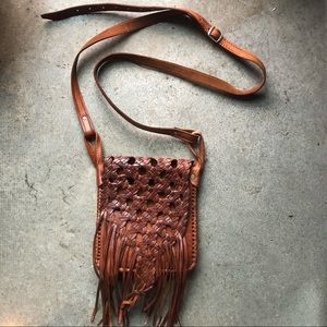 Woven leather fringe cross body bag